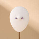 Piercing capezzoli sfera viola opale in argento