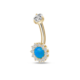 Gold navel piercing with blue crystal