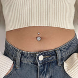 White heart belly button piercing in silver with white crystals