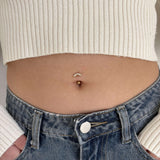 Floating luxury belly button piercing in gold