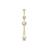 Navel piercing with heart and gold pendants