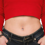 Silver moon navel piercing