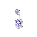 Silver belly button piercing with clusters of purple flowers