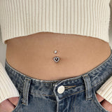 Navel piercing heart from the edge of silver stones