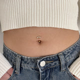 Floating luxury belly button piercing in gold