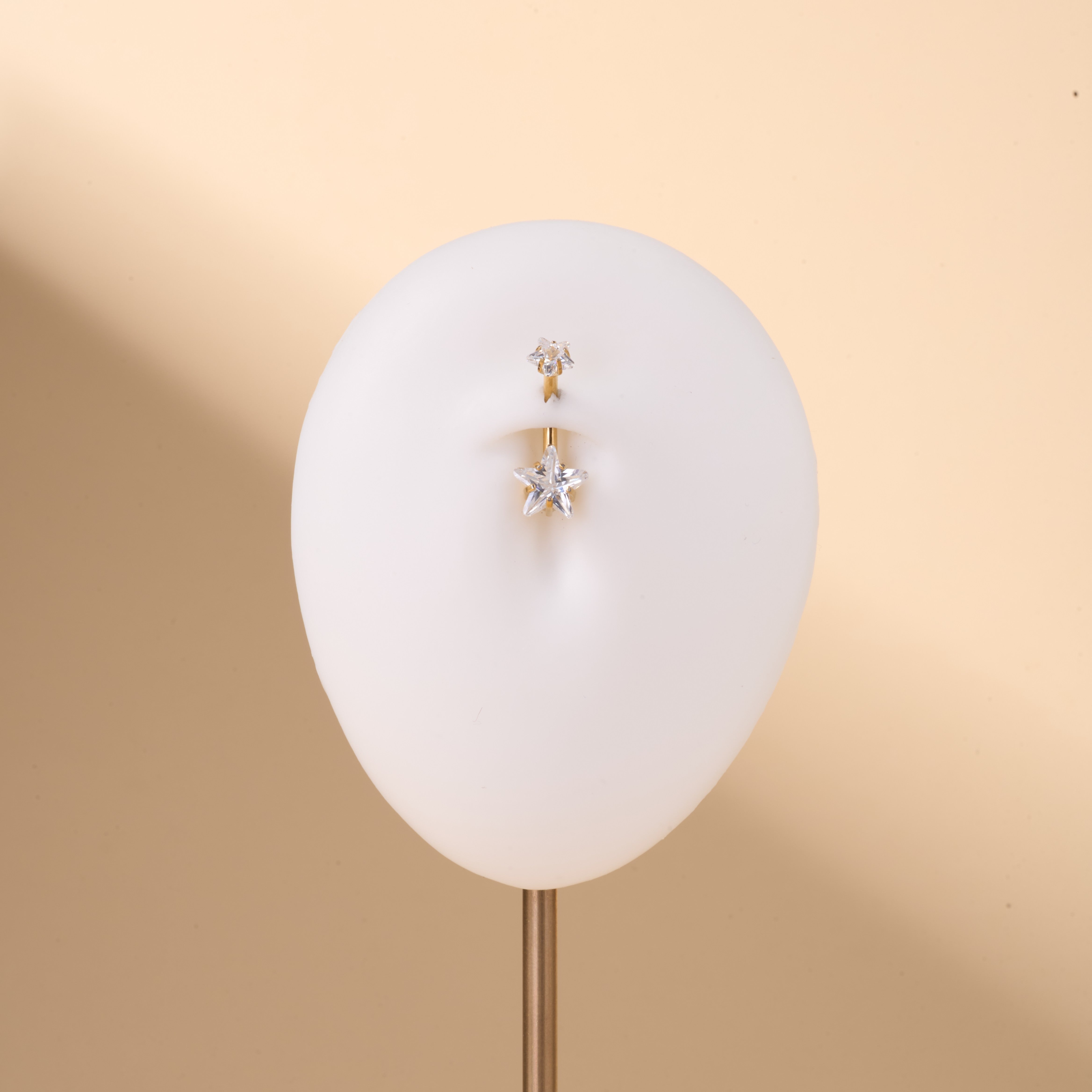 Piercing ombelico con doppia stella bianca in oro - NovaNavel®