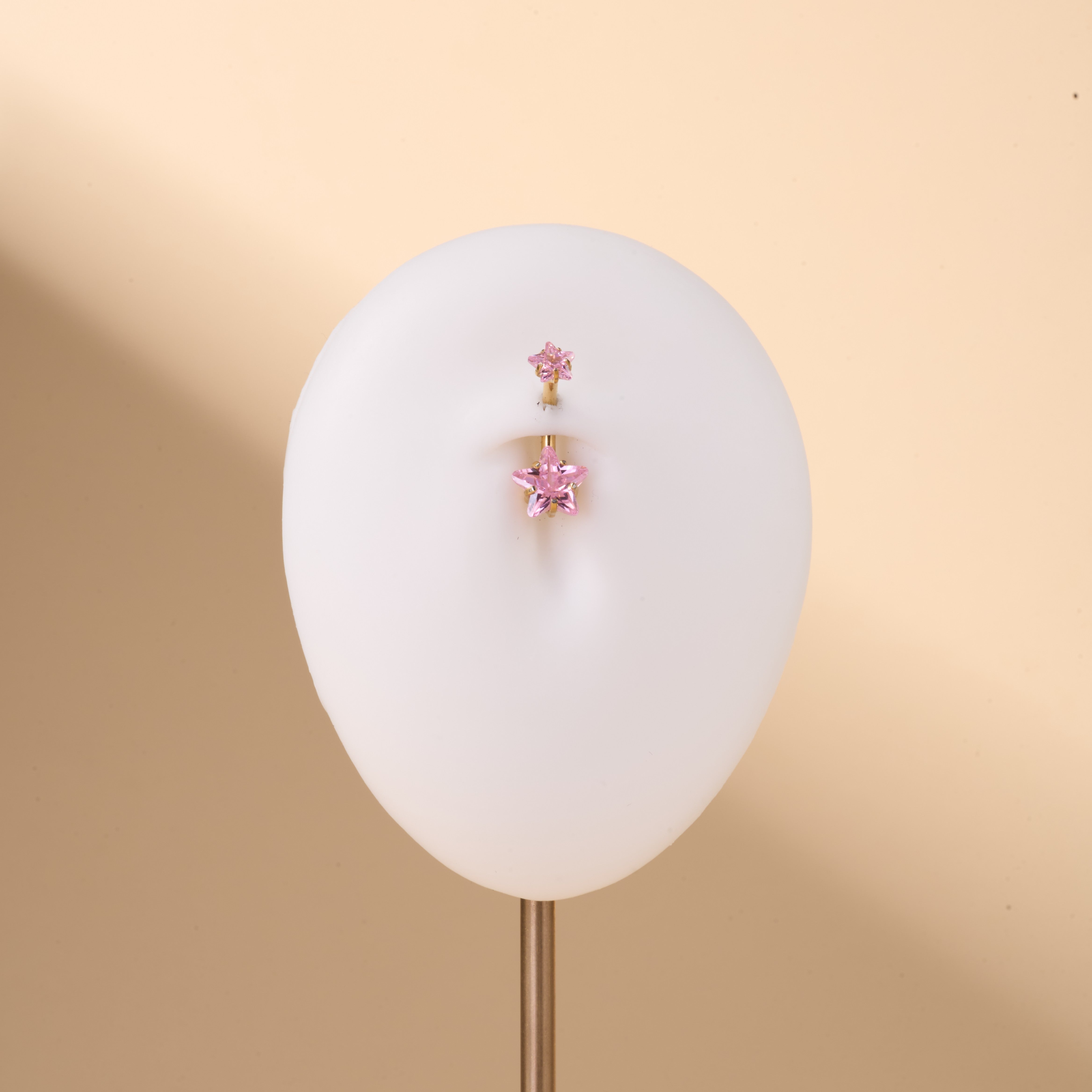 Piercing ombelico con doppia stella rosa in oro - NovaNavel®