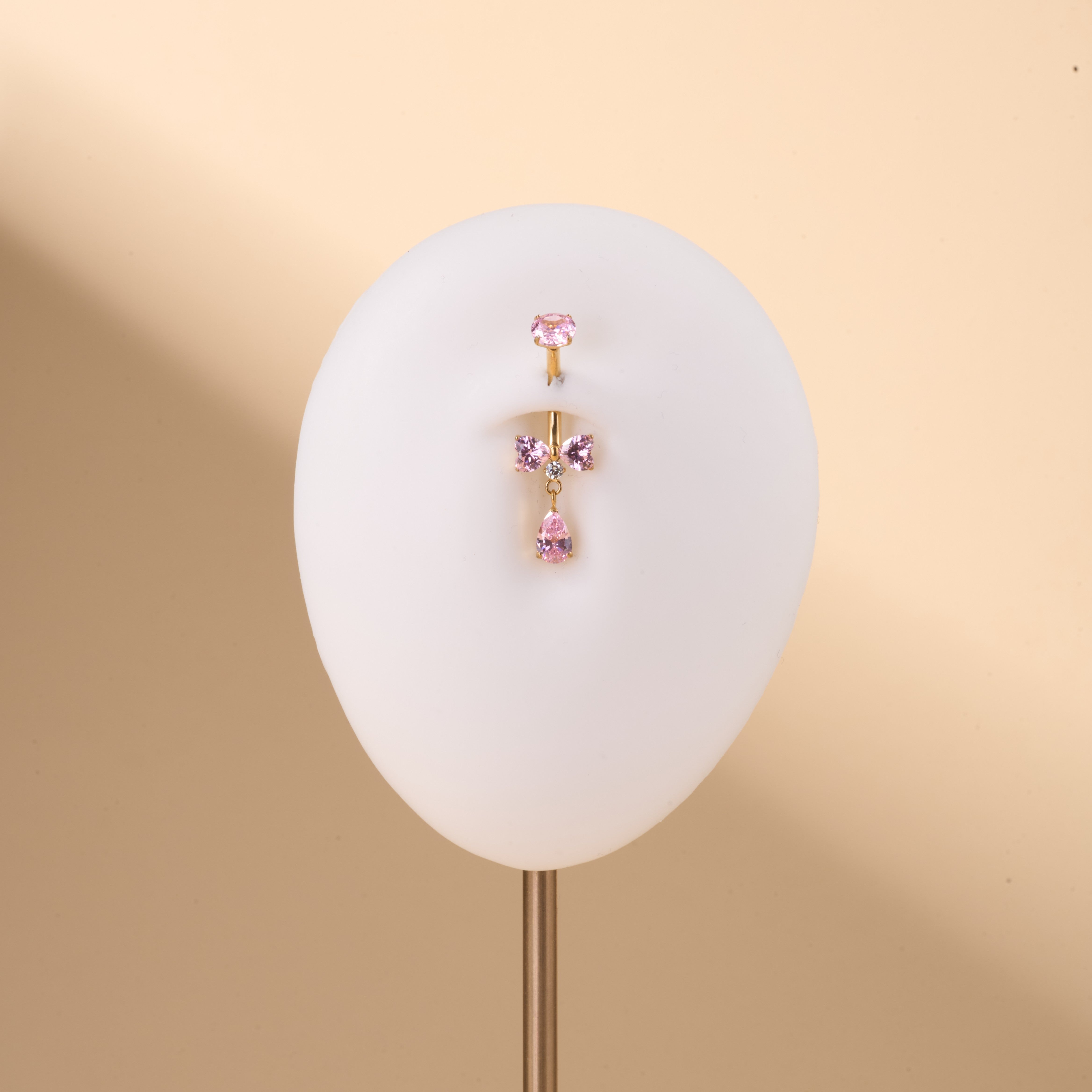 Piercing ombelico mini fiocco rosa e bianco in oro - NovaNavel®