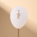 Piercing ombelico piccolo fiore luminoso bianco in oro - NovaNavel®